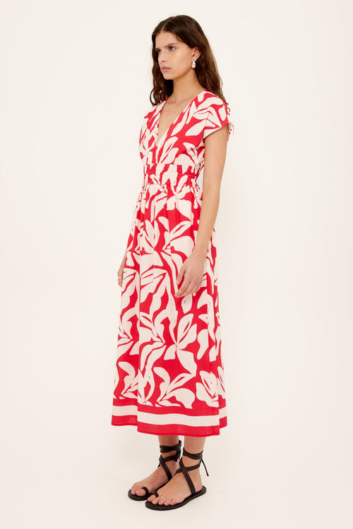 Woman wearing a red white floral dress