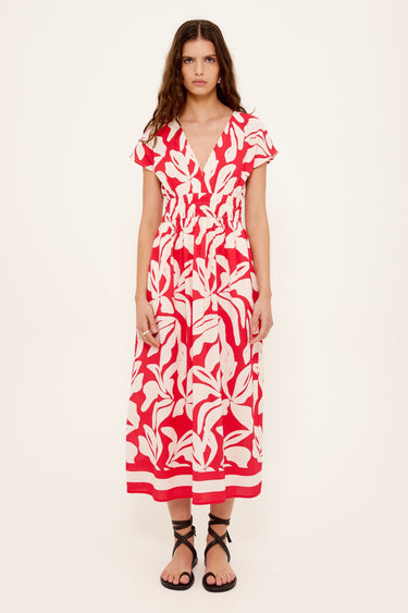 Woman wearing a red white floral dress