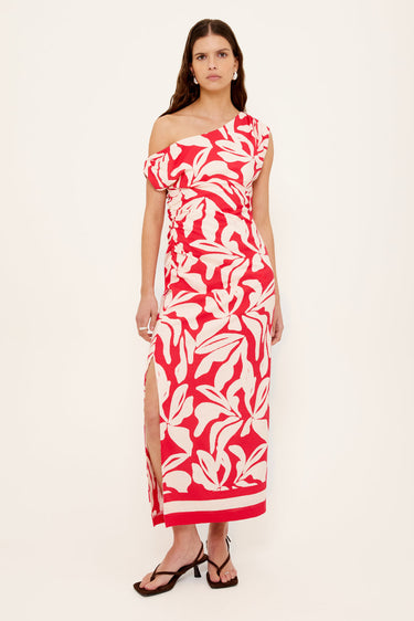 Woman wears a red white floral asymmetric dress