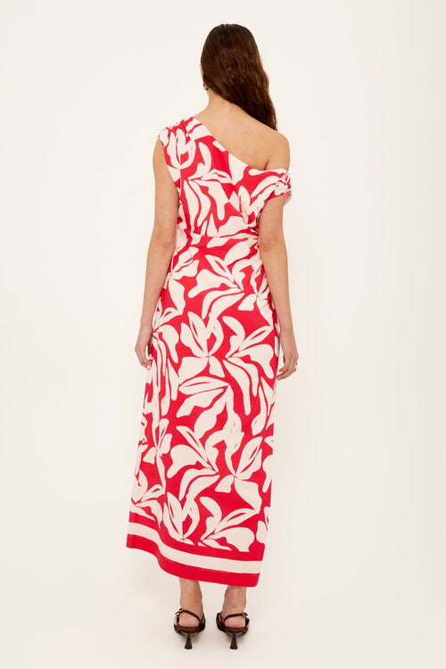 Woman wears a red white floral asymmetric dress