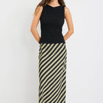 model wearing a silky green black stripe skirt