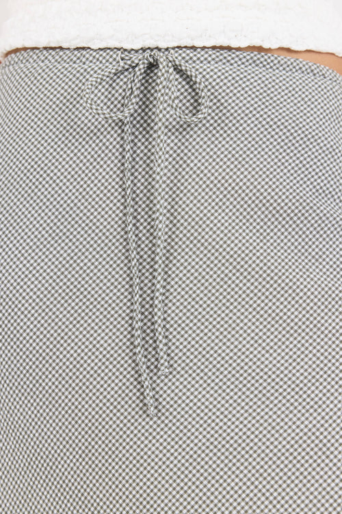 Close-up of a textured fabric with a patterned edge.