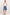 A model stands against a plain white studio background wearing blue denim shorts, a white sleeveless top, black sandals, and layered necklaces.