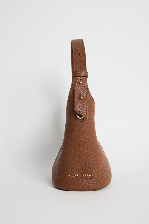 Valencia Brown Leather Multi Strap Mini Tote Bag in a structured bucket silhouette featuring pebbled brown leather, an adjustable shoulder strap and gold hardware, photographed against a clean white background