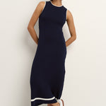model wearing a navy knit dress