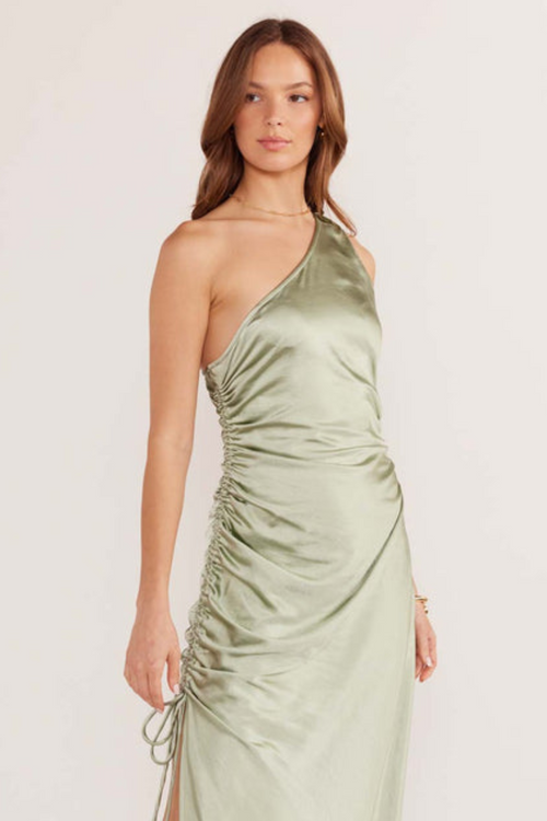 model wears green satin midi dress