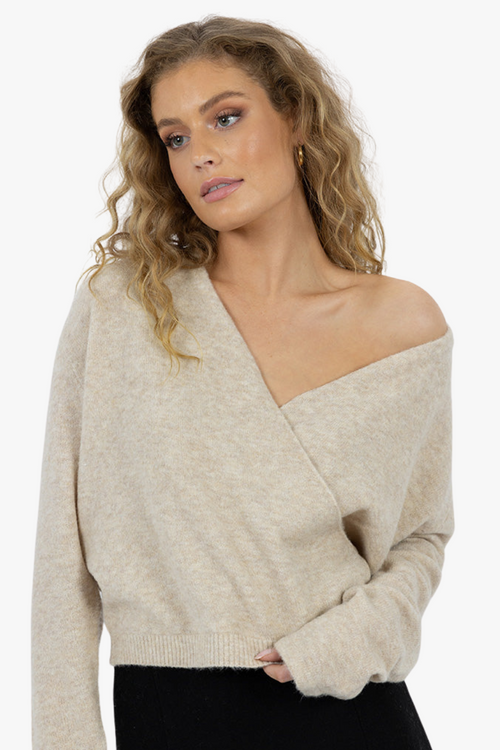 model wearing oat long sleeve v neck jumper