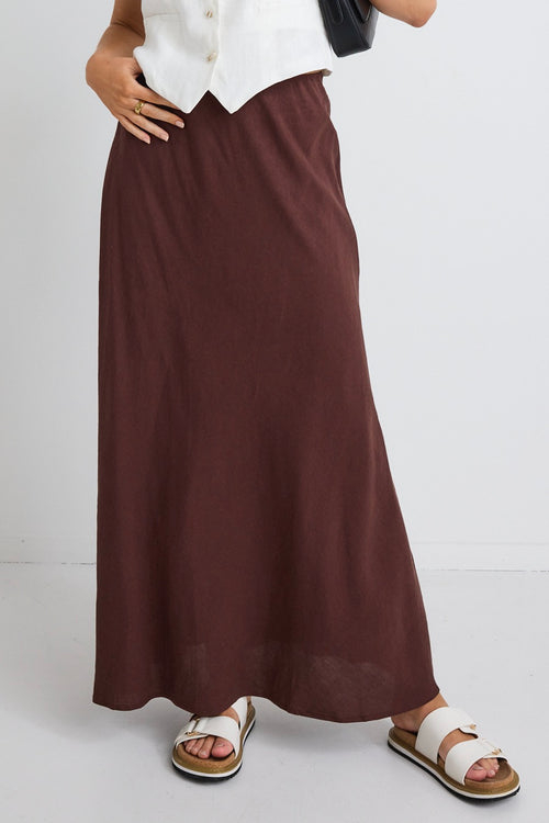 model wears a brown linen maxi skirt