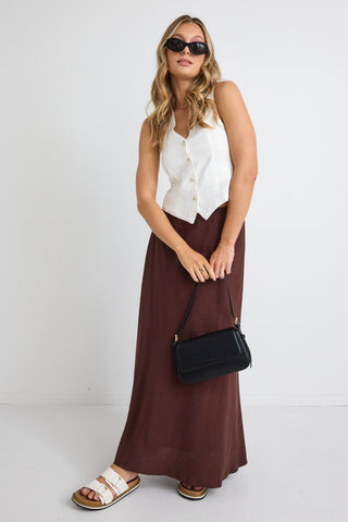 model wears a brown linen maxi skirt