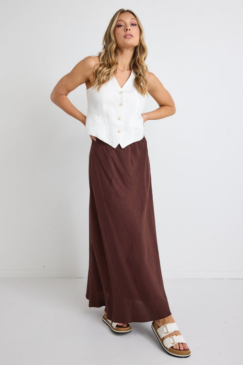 model wears a brown linen maxi skirt