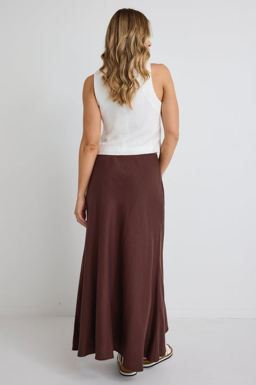 model wears a brown linen maxi skirt