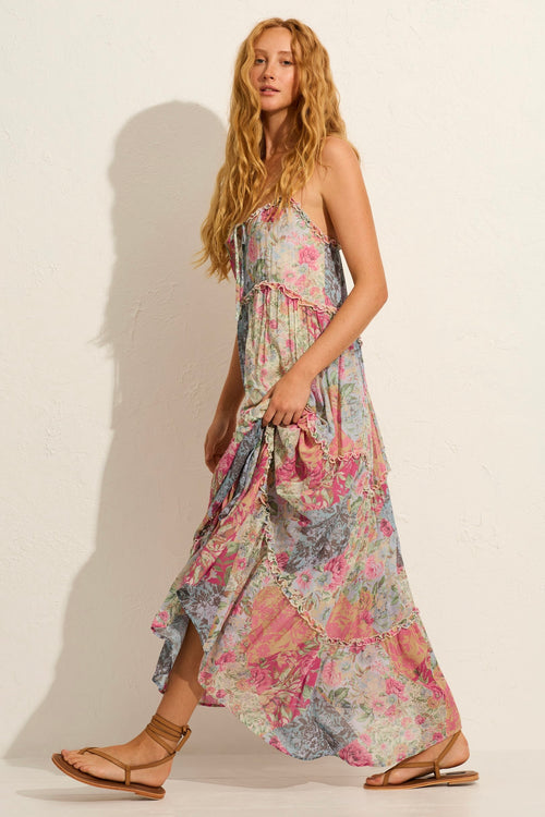 model wears a pink floral maxi dress