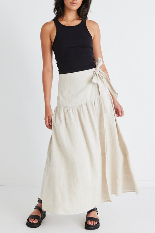 model wears a beige linen maxi skirt