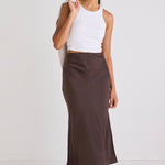 model wears a brown midi skirt