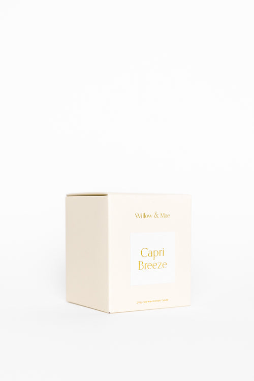 White candle box with 'Capri Breeze' text on a white background