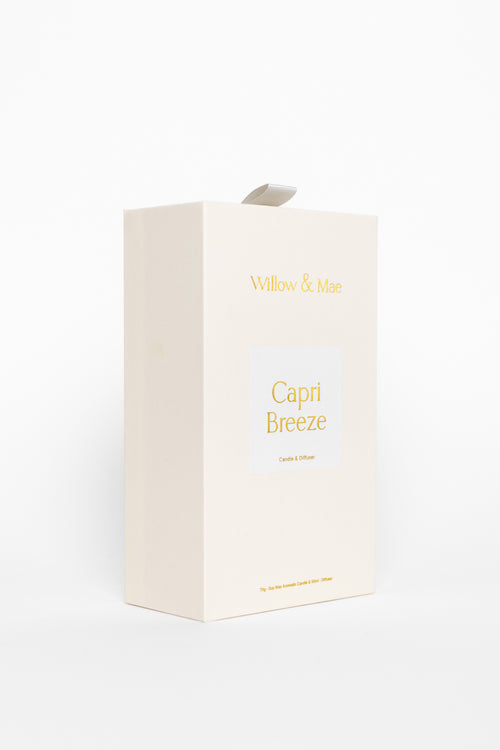 White candle box with 'Capri Breeze' text on a white background