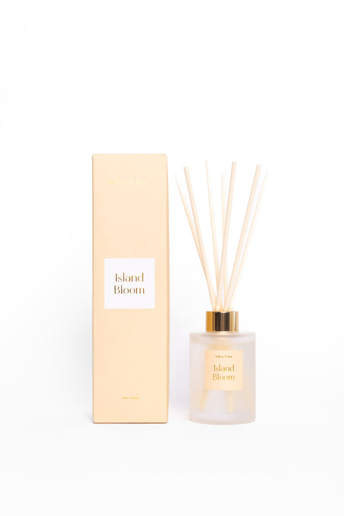 Diffuser bottle and packaging with 'Island Bloom' branding on a white background