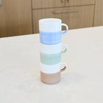 Artist Sage Green hand painted two tone stackable mug shown stacked between blue and taupe mugs; listing is for the green mug only.