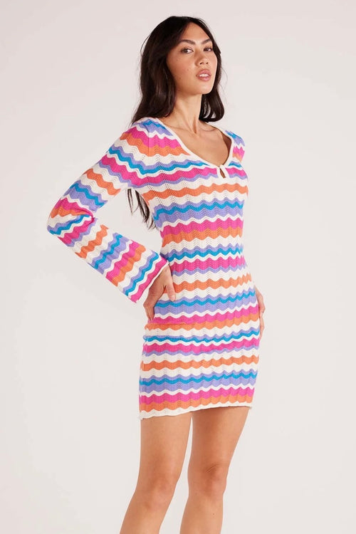 Model wears stripe knit mini dress