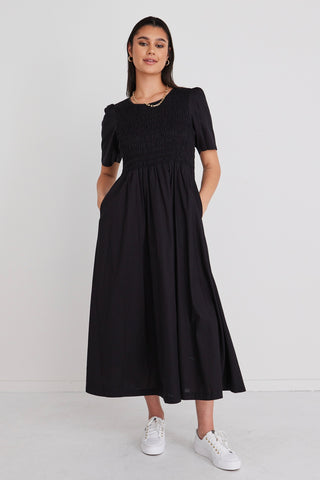 model in long black maxi dress
