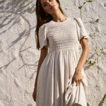 Model wearing natural dress