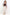 Woman wearing a plaid shirt, brown top, and beige skirt on a white background
