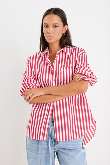 Model wears red stripe shirt and light blue jeans