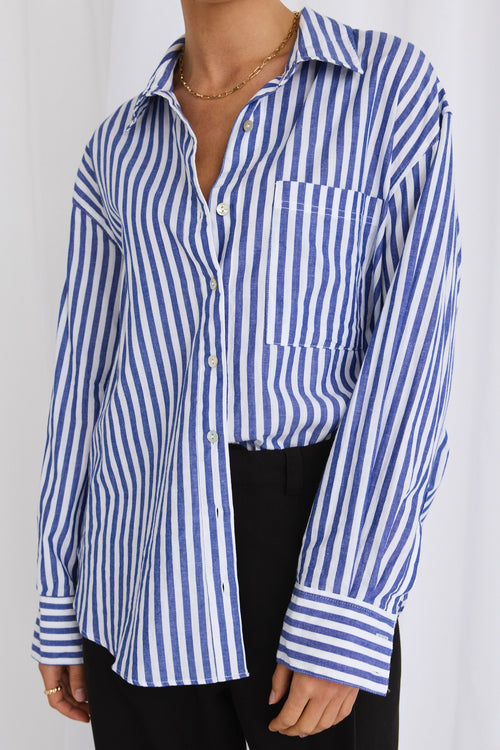 model wears a blue stripe shirt