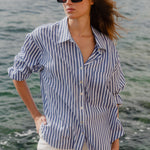 Model wears blue stripe shirt 