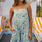 model wears a blue floral maxi dress