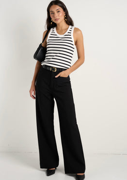 model wears black wide leg pants