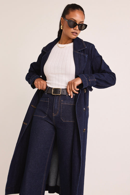 model wears a Blue Denim Trench Coat