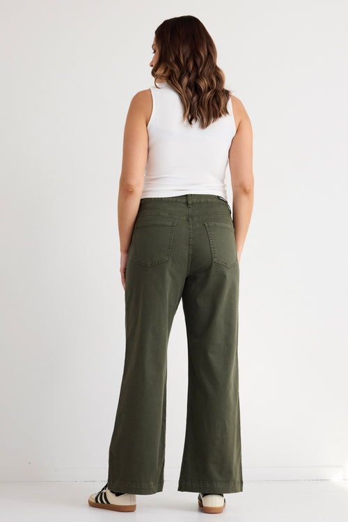 model wears green wide leg jeans