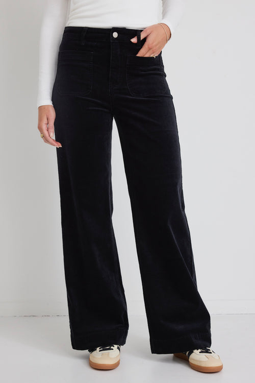 model wears black wide leg jeans