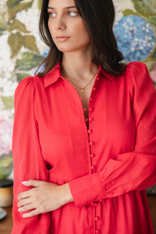 model wears a red maxi dress