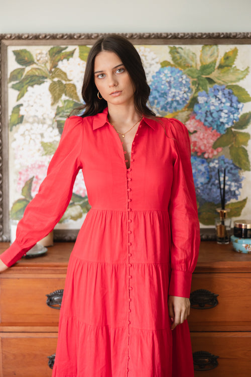 model wears a red maxi dress