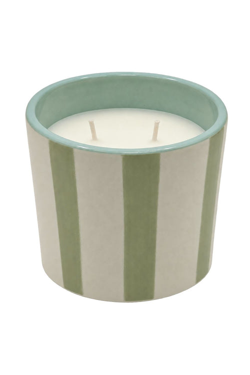 A two-wick scented candle in a cylindrical ceramic jar with vertical sage green and cream stripes, featuring a light teal interior rim, shown on a plain white background.