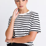 model wears a black and white stripe tee