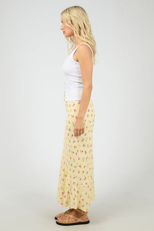 yellow floral maxi skirt with soft pink ditsy print, elasticated waistband, flowy silhouette