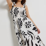 model wears a white and black maxi dress