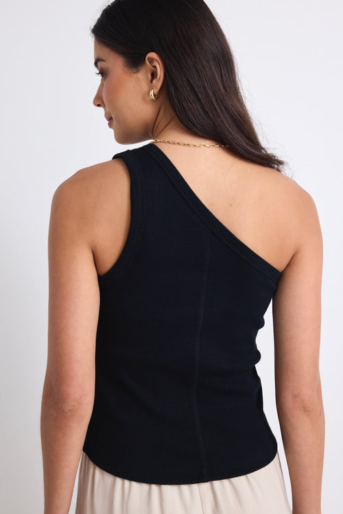 model wears a black one shoulder top