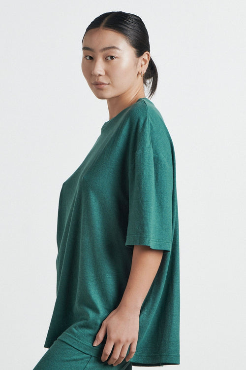 model wears a green t shirt