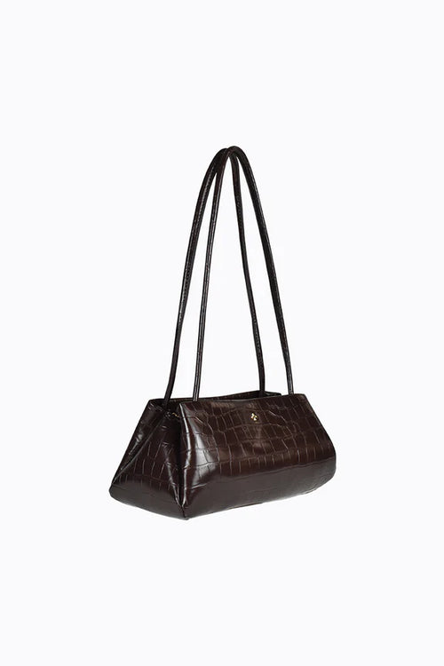 Brown handbag with black straps on a white background
