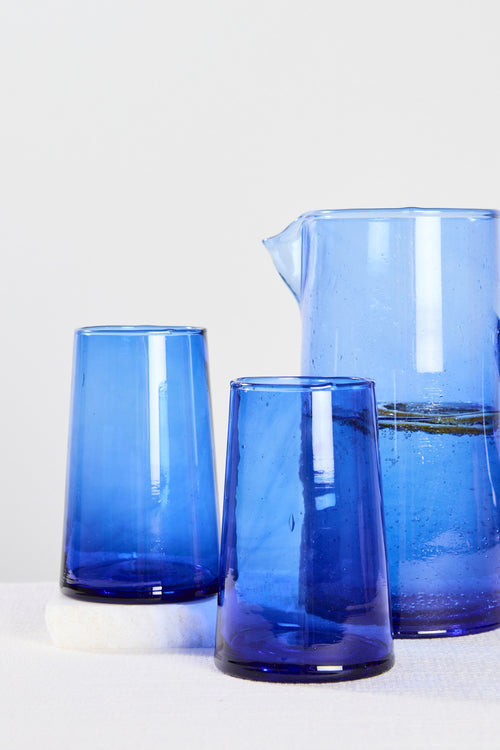 blue wine glasses and jug