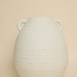 textured white urn