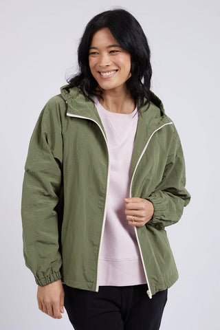 model wears a green jacket