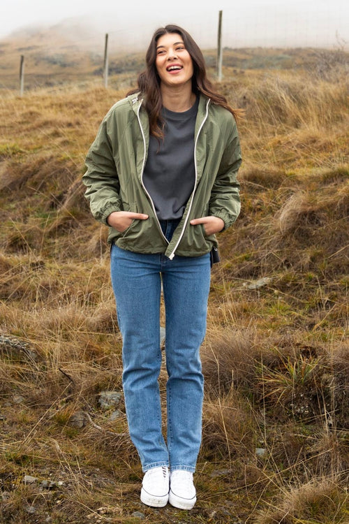 model wears a green jacket