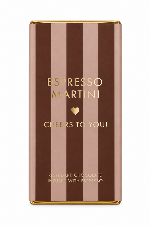 A wrapped chocolate bar in a rectangular foil wrapper with vertical brown and dusty rose stripes, gold foil text reading 'ESPRESSO MARTINI' and 'CHEERS TO YOU!', on a white background.