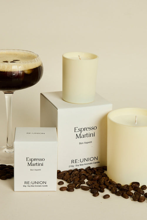 Candle labeled 'Espresso Martini' by Reunion with a glass of espresso and coffee beans on a beige background