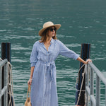 model wears a blue stripe shirt dress